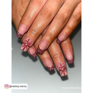 Glittery Square French Tip Acrylic Nails Over White Surface