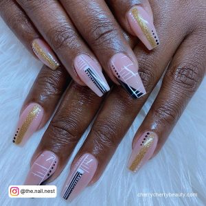 Gold Acrylic Nails With Symmetric Lines