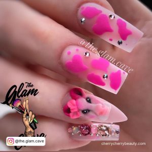 Hot Pink And Cow Print Nails With Hearts And Embellishments