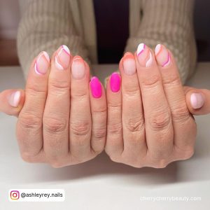 Hot Pink And Neon Orange Nails In Almond Shape