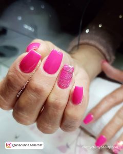 Hot Pink Long Square Nails With Design On Ring Finger