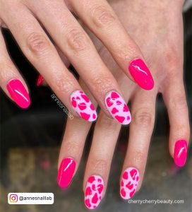 Hot Pink Nails With Cow Print In Almond Shape
