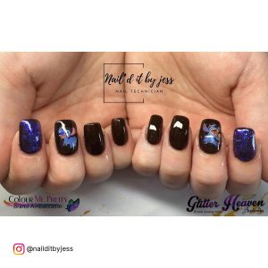 Kilo And Stitch Brown And Navy Blue Acrylic Nails Over White Surface