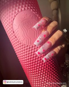 Light Pink Nails With Hearts In Coffin Shape