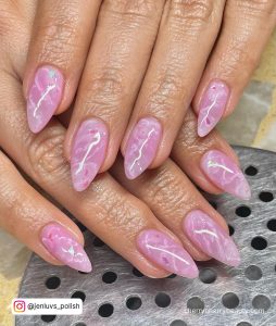 Light Pink Nails With Marble In Stiletto Shape