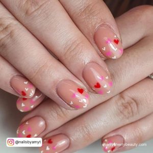 Light Pink Nails With Red Hearts On Almond Shape