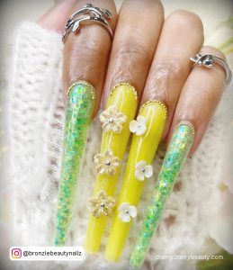 Light Yellow Acrylic Nails With Two Fingers In Green Color