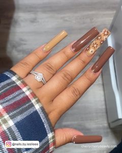 Long Brown Acrylic Nails With Flowers