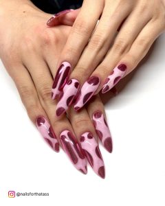 Long Pink Chrome Nails With Dark Pink Spots