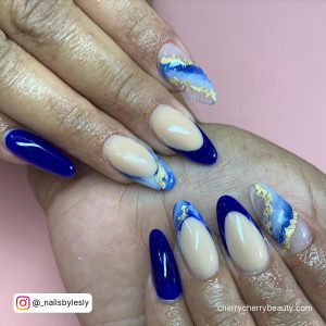 Marble Blue Almond Acrylic Nails With Gold Flakes On Pink Surface
