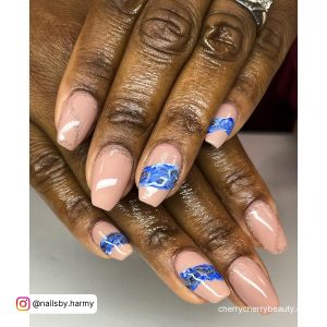 Marble Tapered Square Acrylic Nails With Glitters Over White Surface