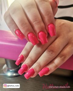 Medium Pink Square Nails On A Pink Surface