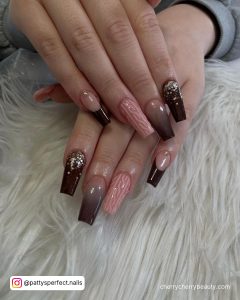 Mocha Brown Acrylic Nails With A Different Design On Each Finger