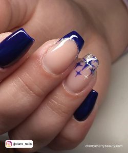 Navy Blue And Silver Acrylic Nails With Design On Two Fingers
