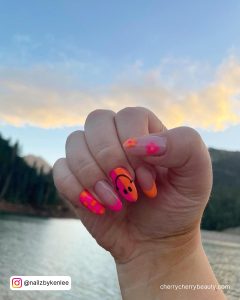 Neon Pink And Orange Nails With Smiley