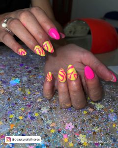 Neon Short Almond Acrylic Nails Designs Over Glittery Surface