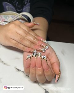 Nude And White Acrylic Nails With A Touch Of Black
