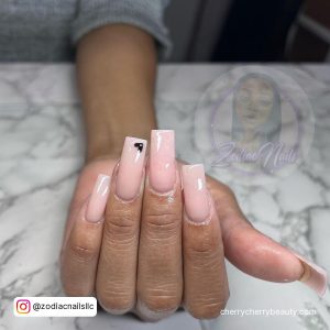 Nude Nails Acrylics With A Black Heart