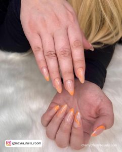 Ombre Orange Acrylic Nails With Swirls