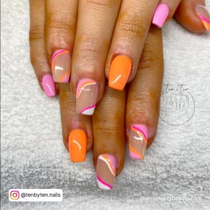 Orange And Pink Coffin Nails With Swirls