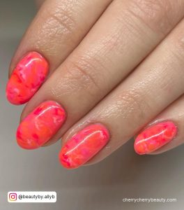 Orange And Pink Neon Nails With Marble Effect