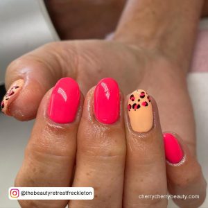 Orange And Pink Neon Nails With Pattern On Two Fingers