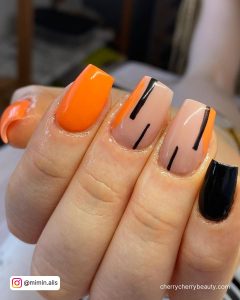 Orange Nails With Black Line Design