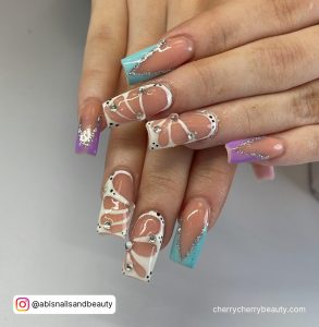 Pastel And White Butterfly Nail Designs