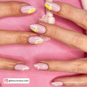 Pastel Pink And Yellow Nails In Almond Shape