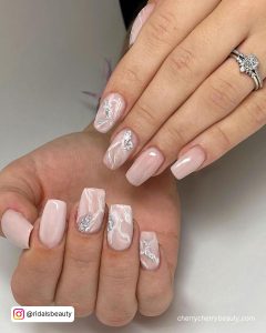 Pastel Pink Marble Nails With A Glossy Finish
