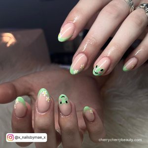 Pastel Spring Acrylic Nails In Green With Black Design