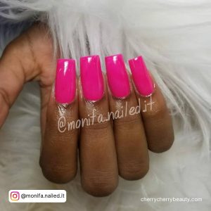 Pink Acrylic Square Nails On A White Fur Surface