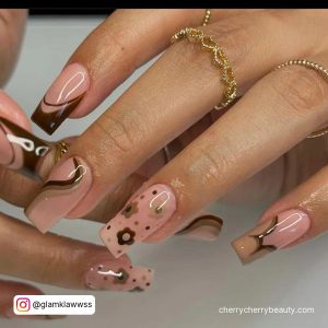 Pink And Brown Acrylic Nails With Swirls And Flowers