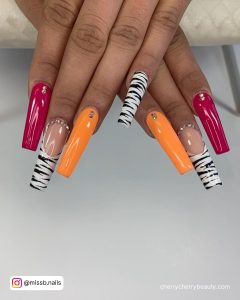 Pink And Orange Summer Nails With Zebra Print On Two Fingers