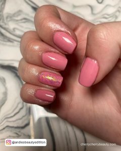 Pink Glitter Square Nails On A Marble Surface