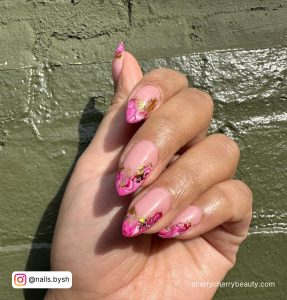 Pink Marble Nails With Gold Flakes In Stiletto Shape