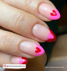 Pink Nails With Red Heart On Two Fingers