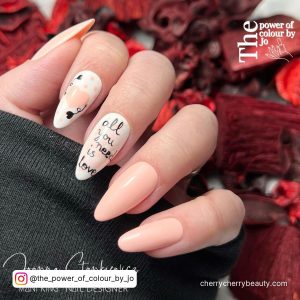 Pink Pastel Nail Designs With Written Text On One Finger