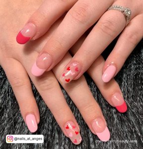 Pink Valentines Nails With Hearts In Almond Shape