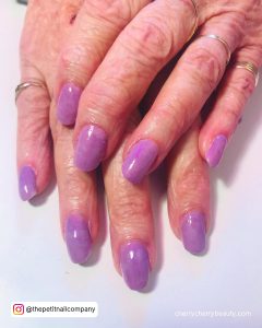 Pretty Lilac Simple Acrylic Nails Over White Surface