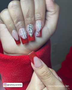 Red French Top Acrylic Nails With Rhinestones And Snowflakes Design