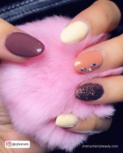 Round Cute Fall Acrylic Nails With Glitters And Stones Over Pink Fur