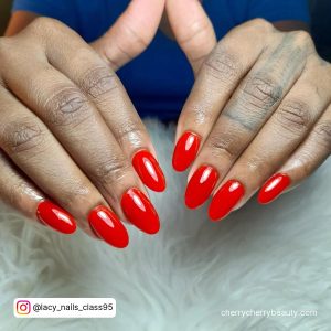 Round Short Red Acrylic Nails Over White Fur