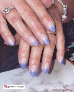 Short Simple Ombre Acrylic Nails Over Marble Surface