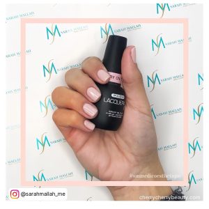 Short Square Acrylic Nails Pink Holding A Nail Polish
