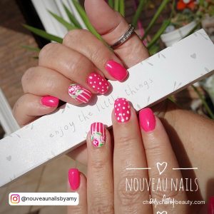 Short Square Pink And White Nails Holding A Paper
