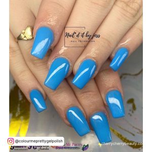 Simple Blue Acrylic Nail Inspo Over White And Gold Surface