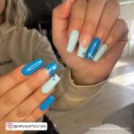 Simple Lift Blue Acrylic Nails With Hearts And Lady In Background
