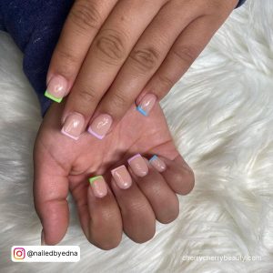 Simple Short Square Acrylic Nails With Multicolored French Tips Over White Fur