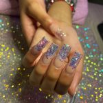 Square Glitter Acrylic Nails Over Shimmery Surface